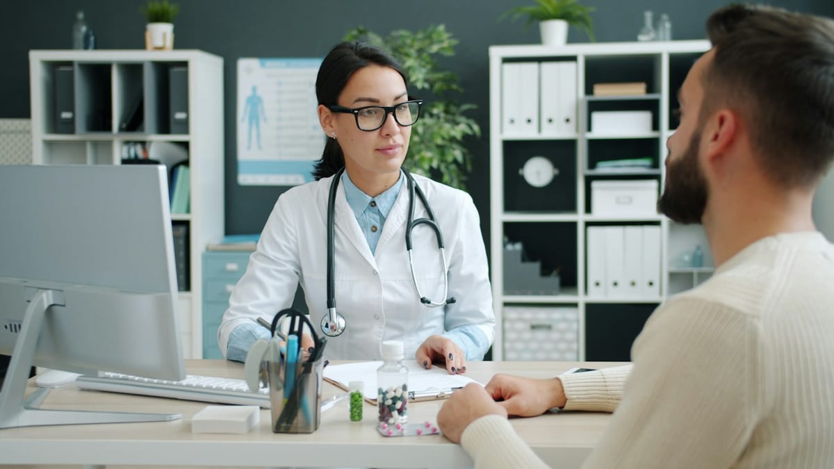 A provider talking with a patient during a consultation